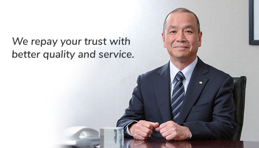 Half-body photo of Kitz SCT President, Mitsuo Kasahara, with text, "We repay your trust with better quality and service".